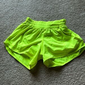 Lululemon Athletica 4” hotty hot shorts size 4 “highlighter yellow”